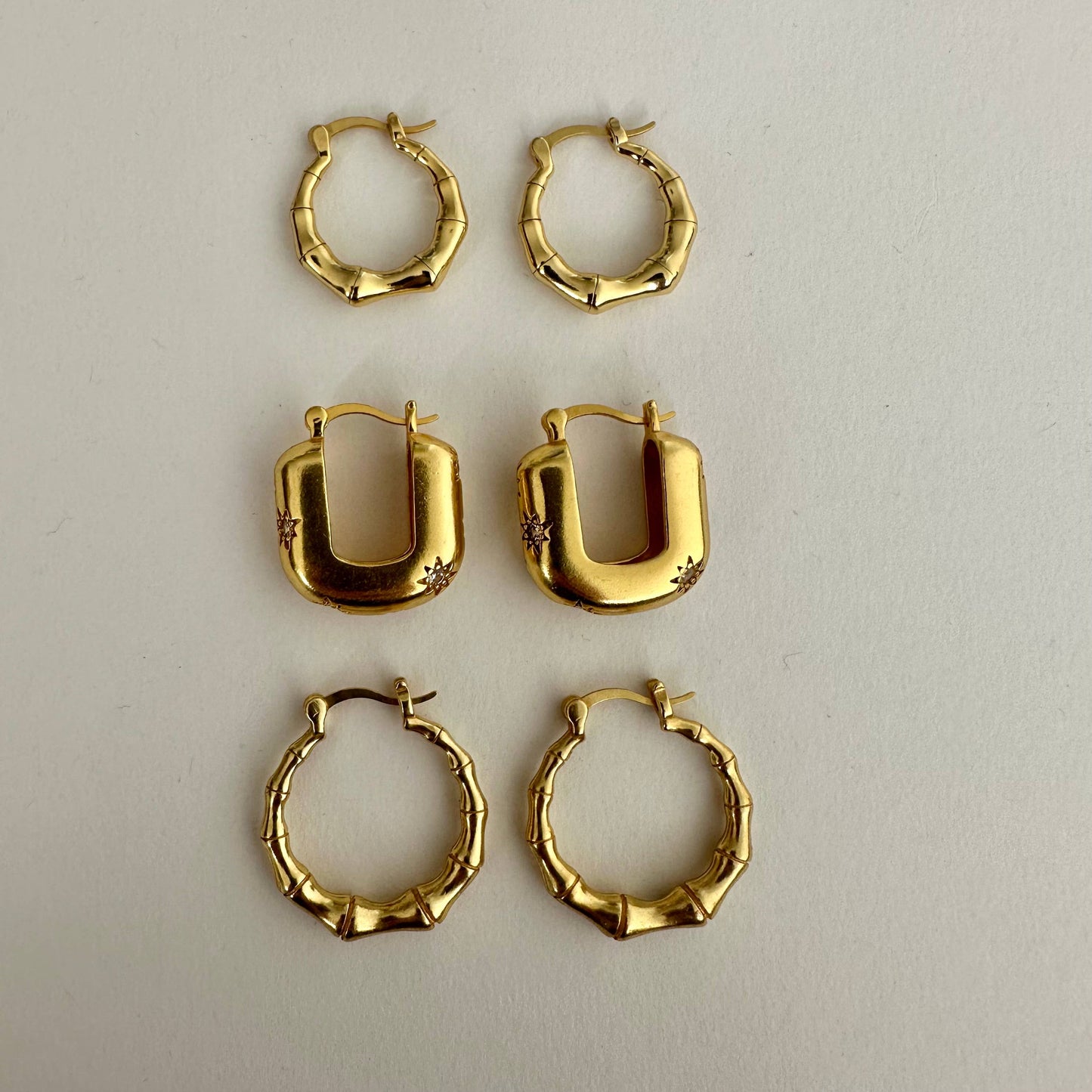 Chic modern star gold hoop earrings by Anokhi Green, view 5