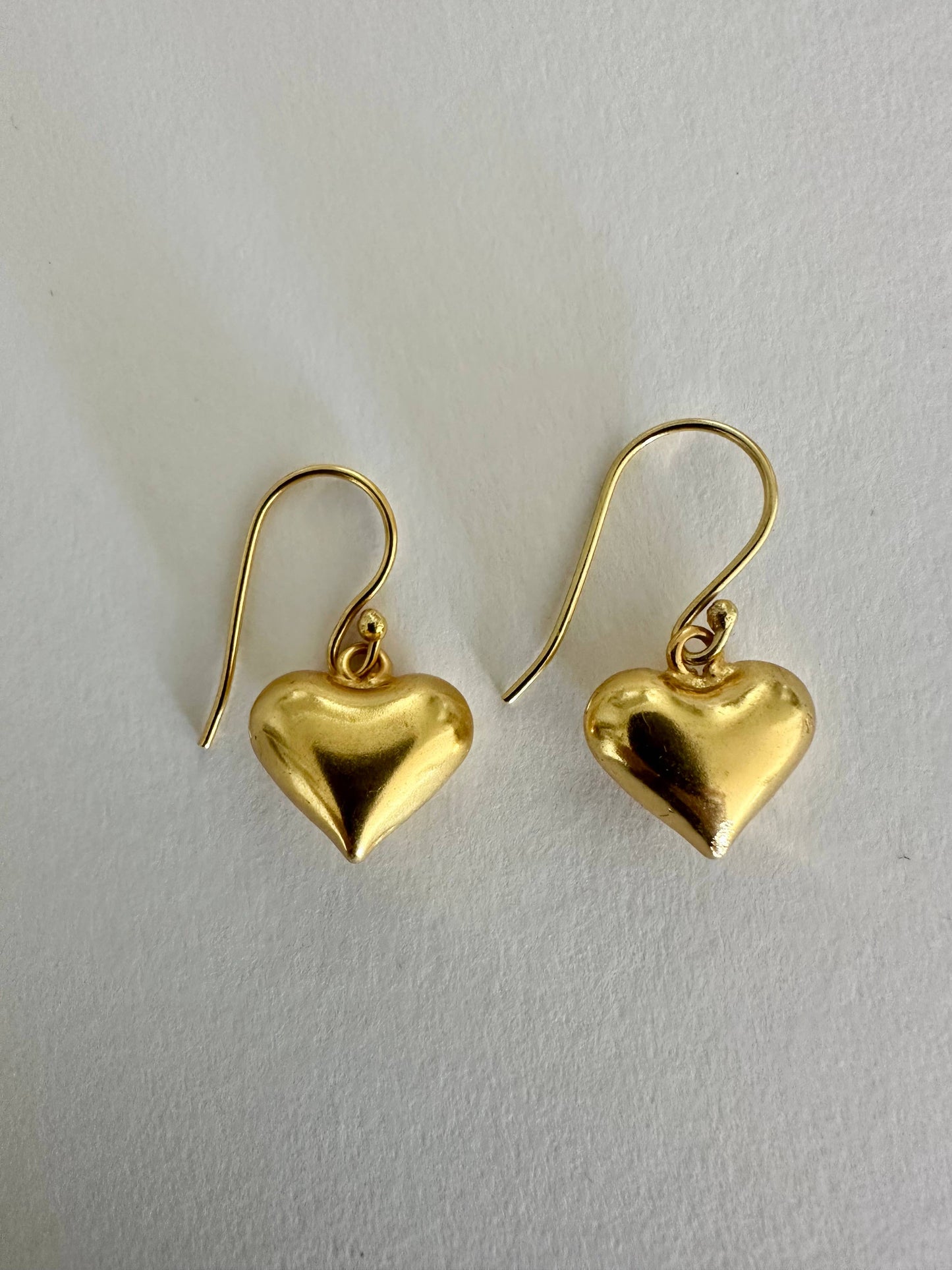 Small hearts gold dangle earrings by Anokhi Green