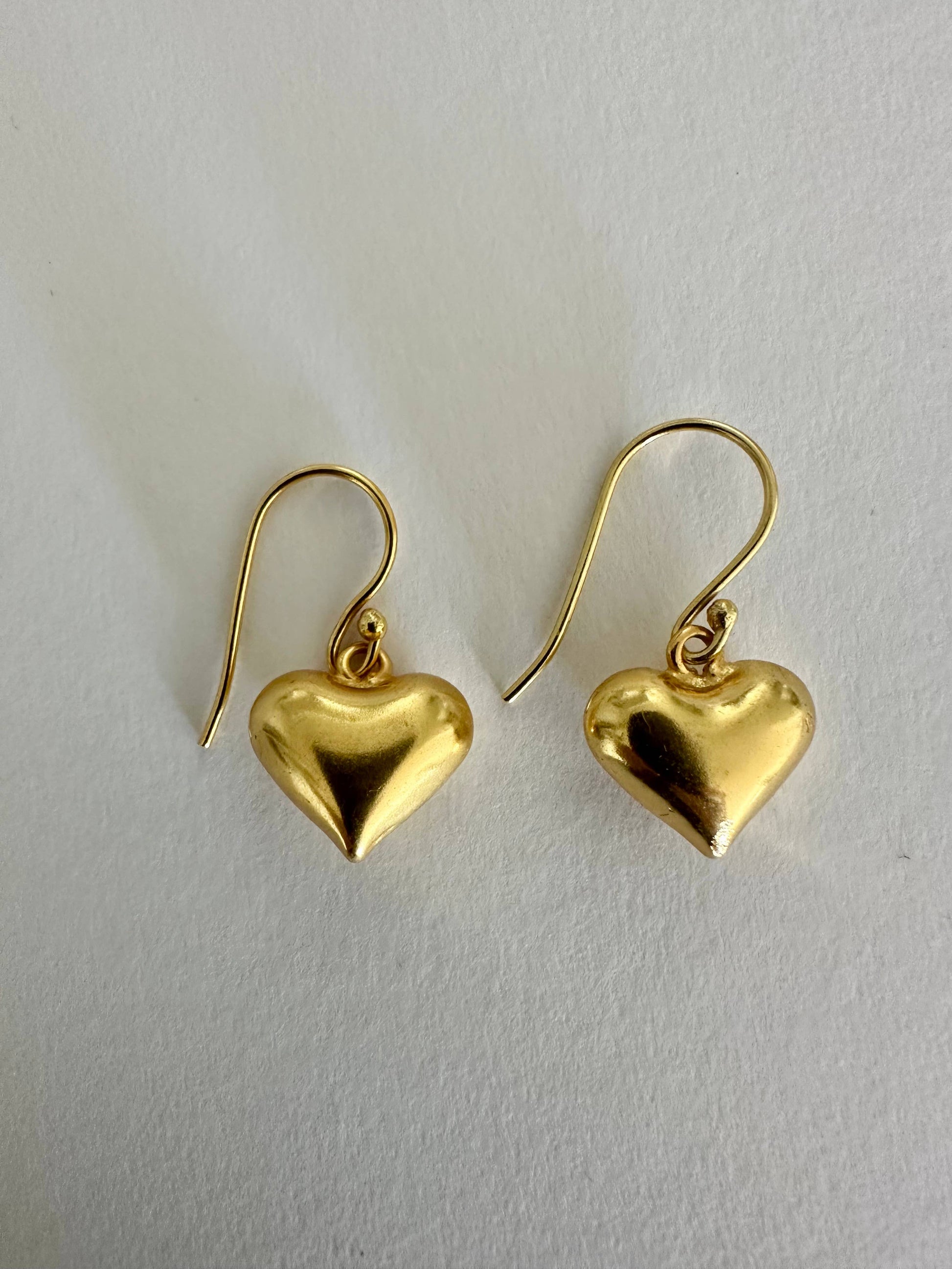 Small hearts gold dangle earrings by Anokhi Green