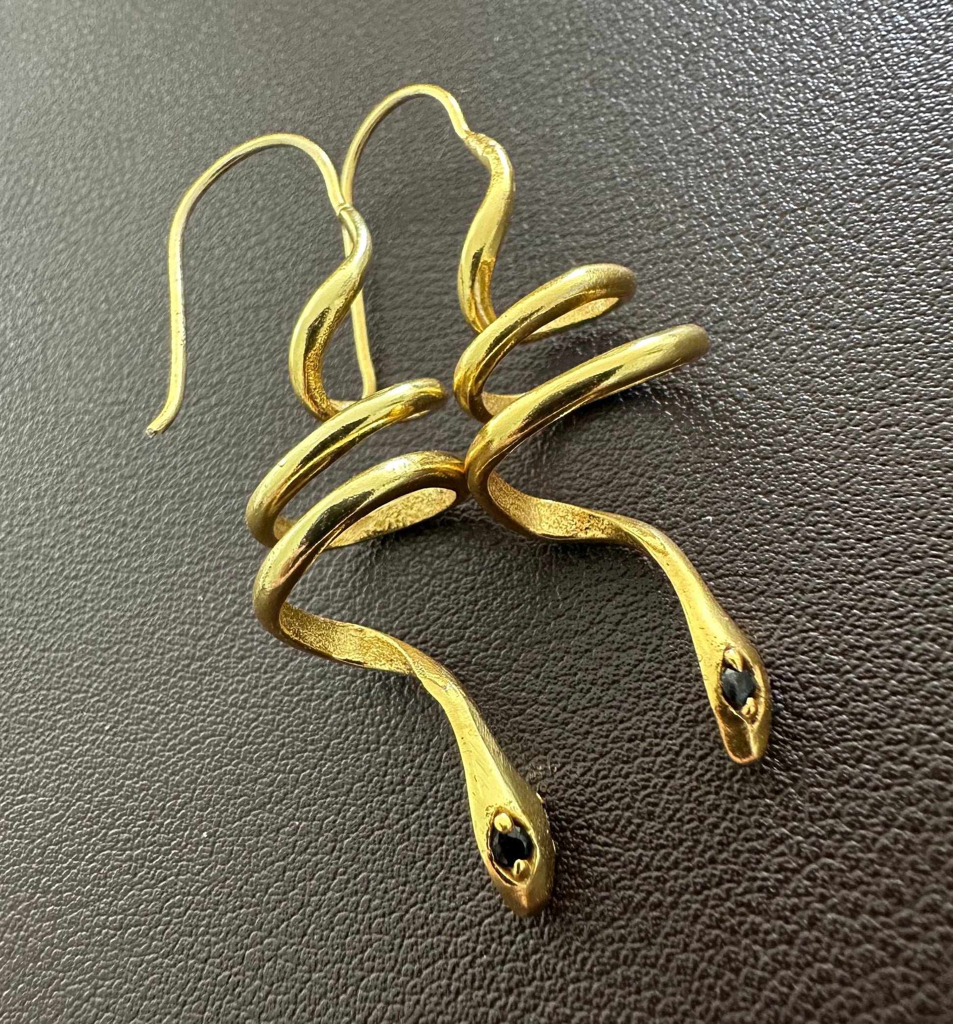 Gold snake earrings with green zircon eyes by Anokhi Green, view 3