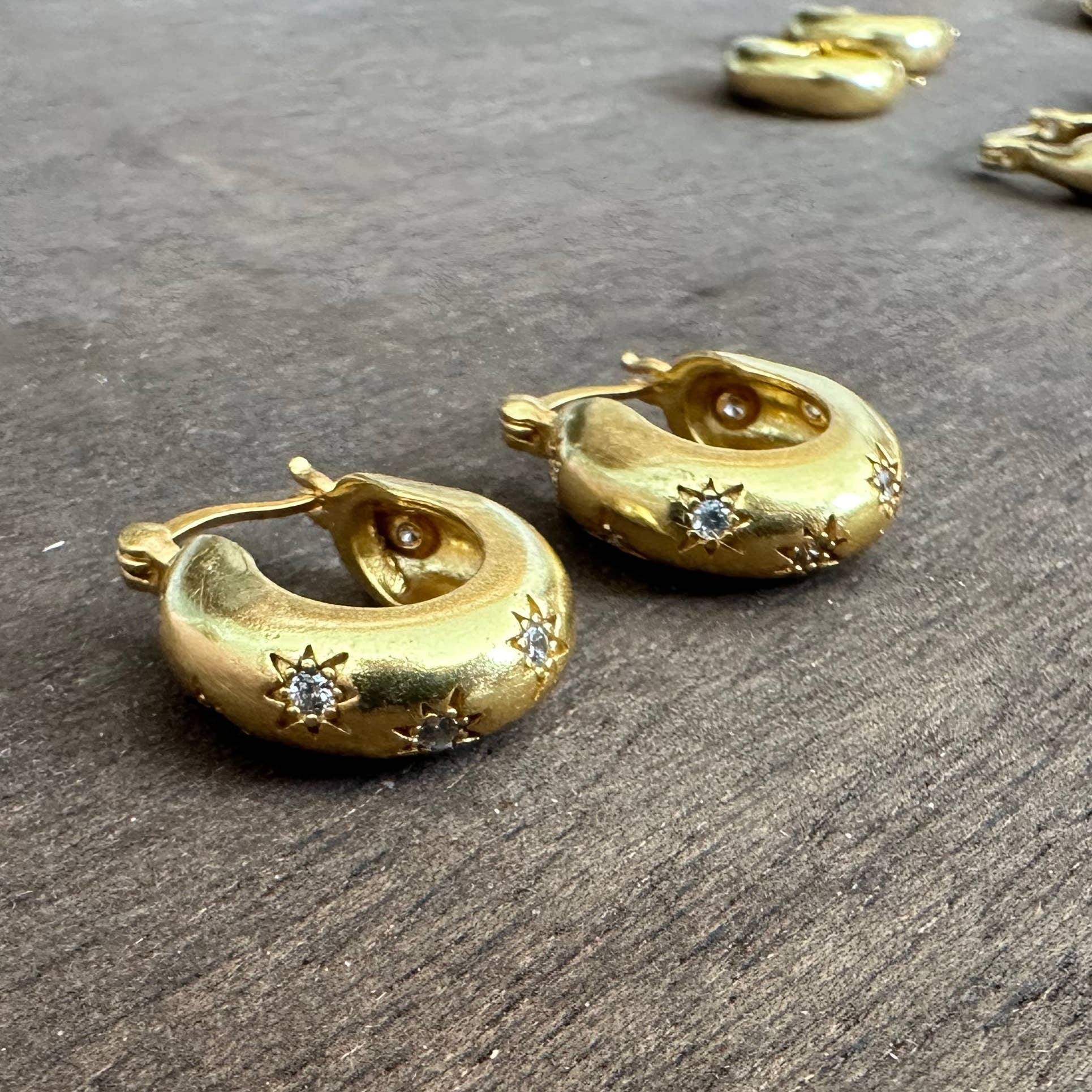Star gold hoop earrings with zircon by Anokhi Green