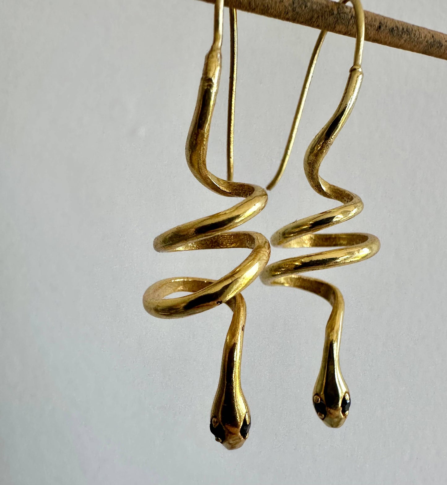 Gold snake earrings with green zircon eyes by Anokhi Green, view 4